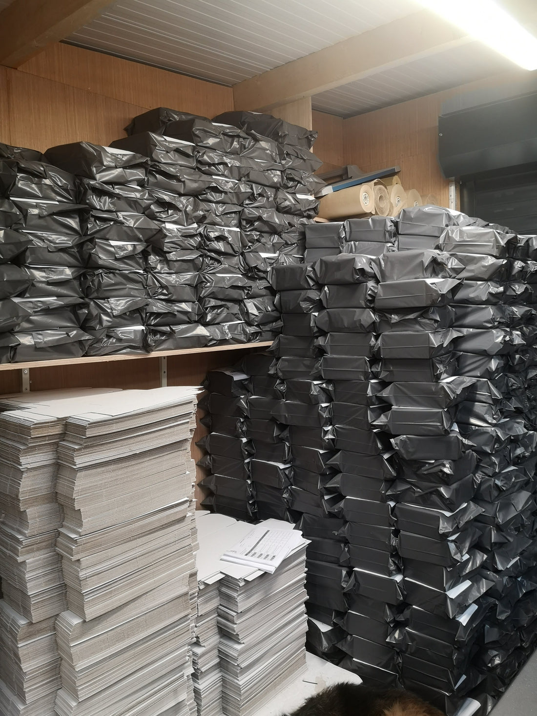 A stack of The Book Resort's signature luxury gift boxes ready for nationwide dispatch, with an An Post tracking label visible, emphasizing fast and reliable Irish delivery for Mother's Day.