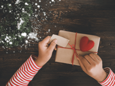 A luxury Irish gift box being prepared for international delivery, featuring a handwritten Christmas card and artisan treats.