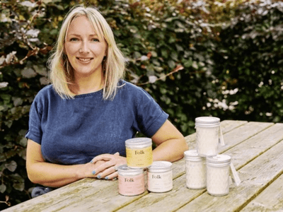Alix Mulholland of FieldDay Ireland surrounded by wildflowers and her signature scented candles.
