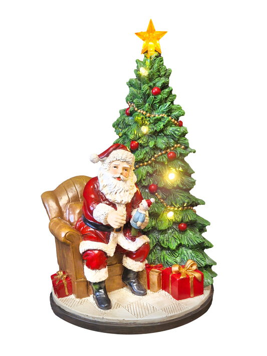 Santa beside Christmas Tree