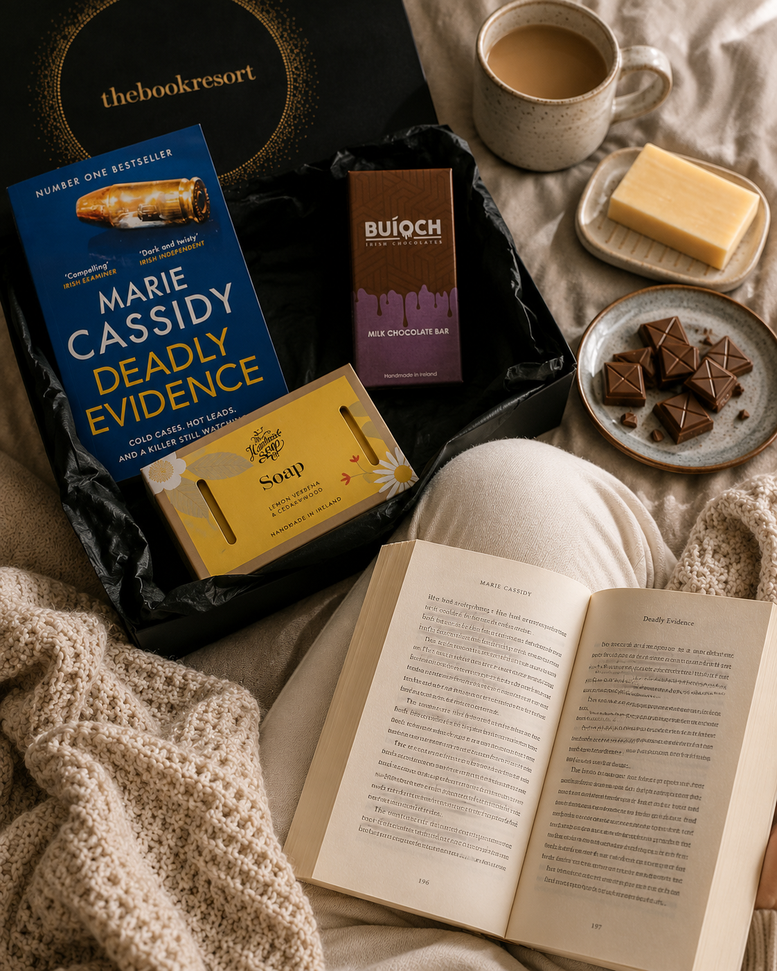 Gift Hamper from The Book Resort with a new book, a bar of soap and a large bar of milk chocolate.